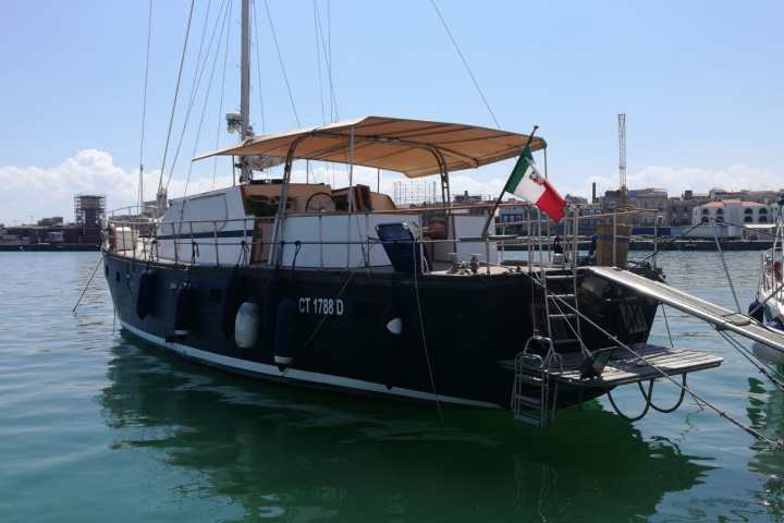a boat is docked next to a body of water