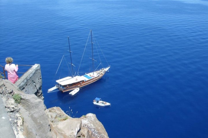 a small boat in a body of water