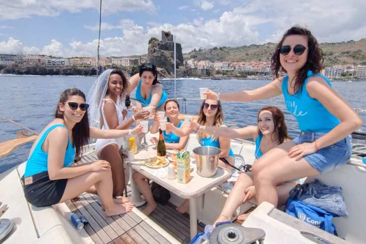 a group of people on a boat posing for the camera