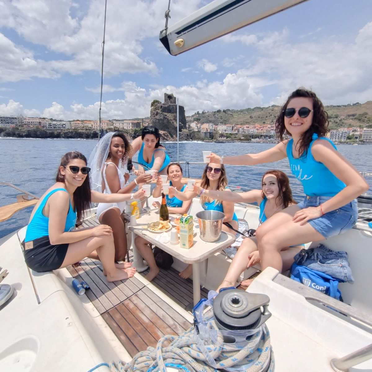 a group of people on a boat posing for the camera