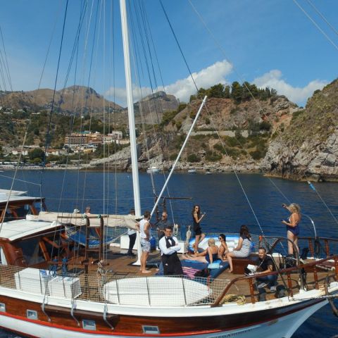 a boat is docked next to a body of water