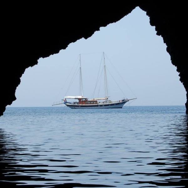 a small boat in a large body of water