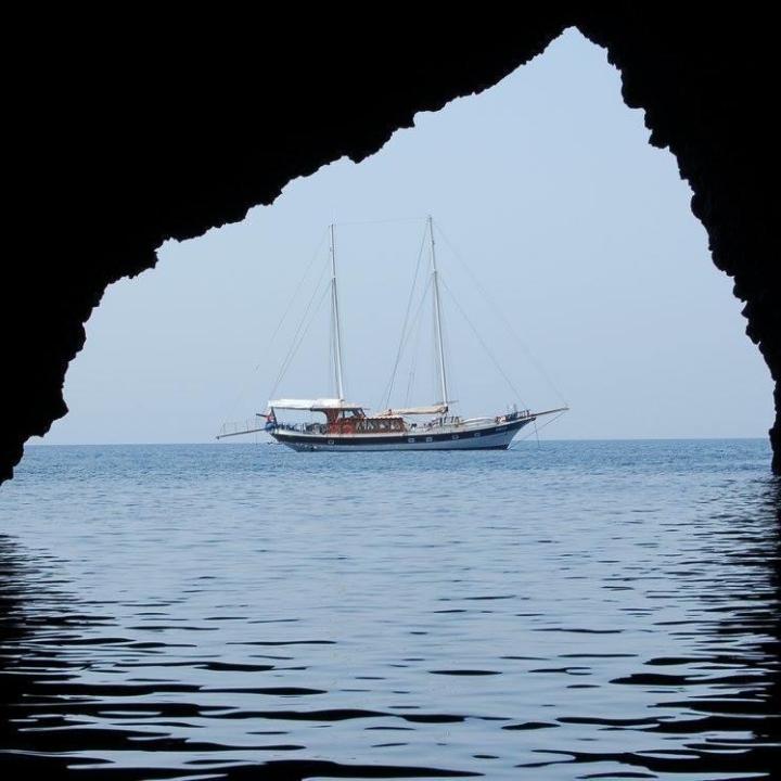 a small boat in a large body of water
