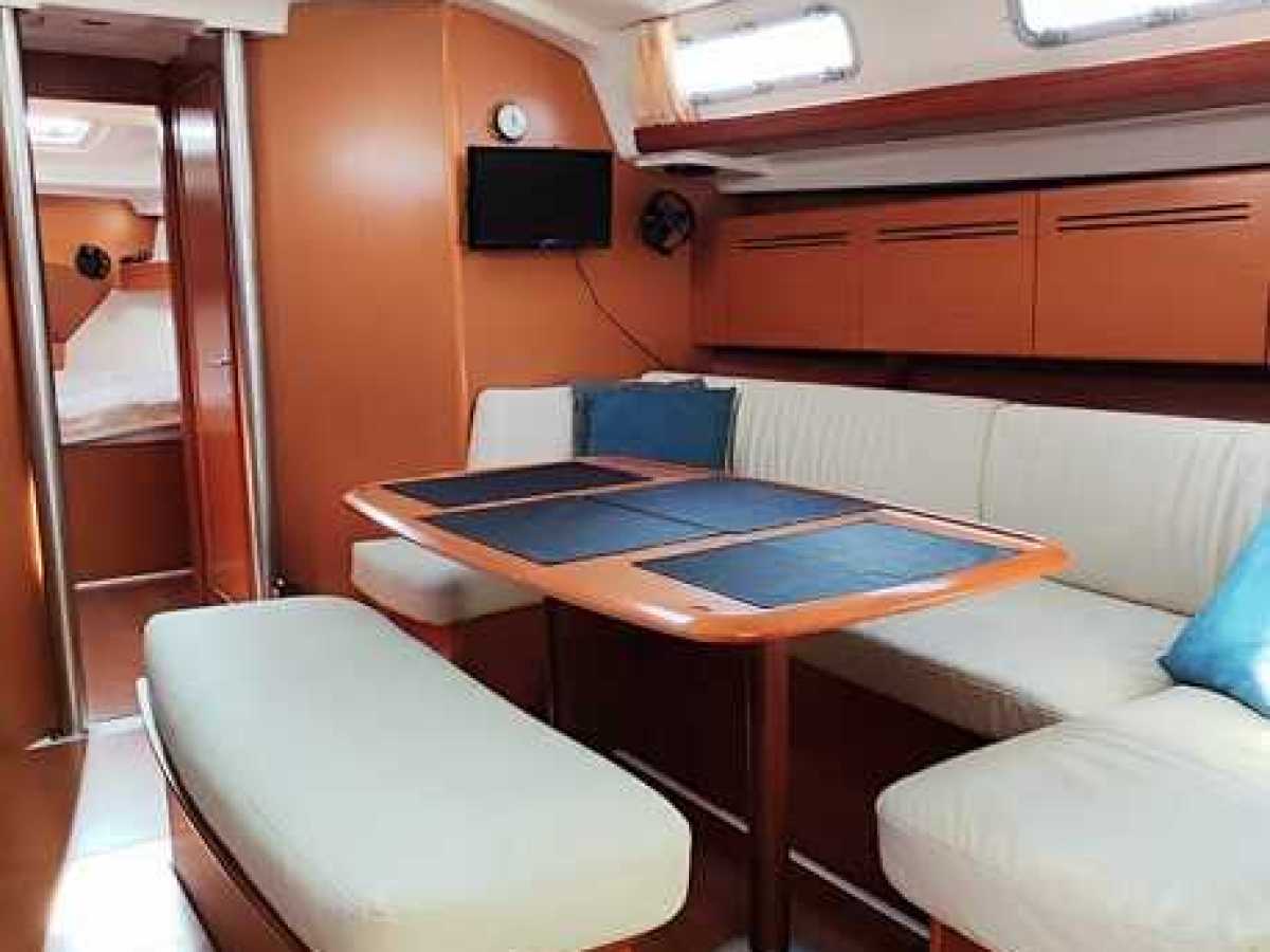 a bedroom with a bed and desk in a small room