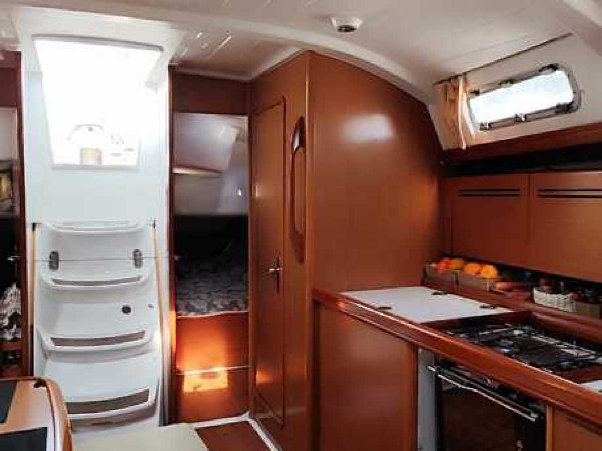 a stove top oven sitting inside of a kitchen