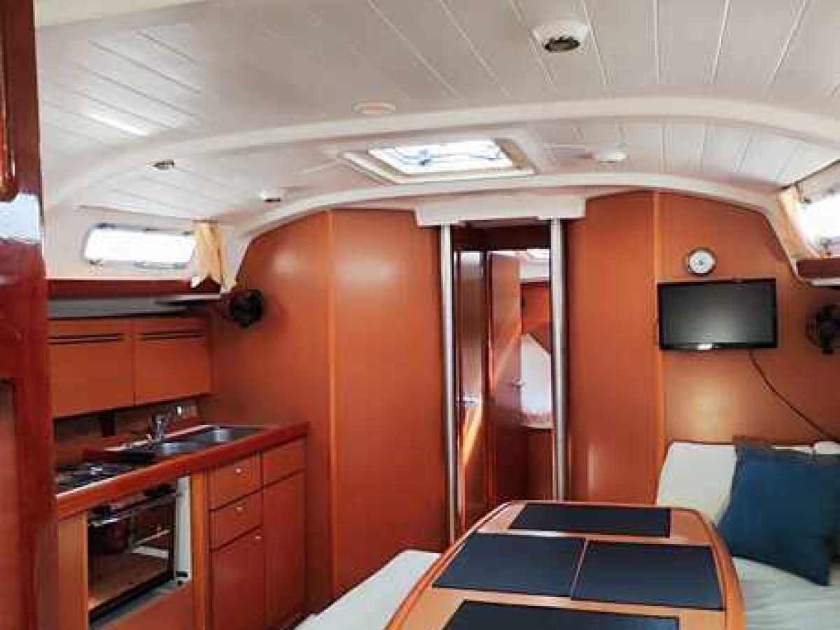 a bedroom with a bed and desk in a room