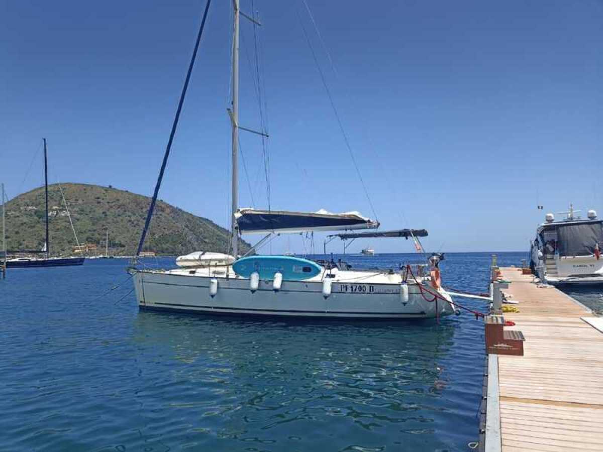 a boat is docked next to a body of water