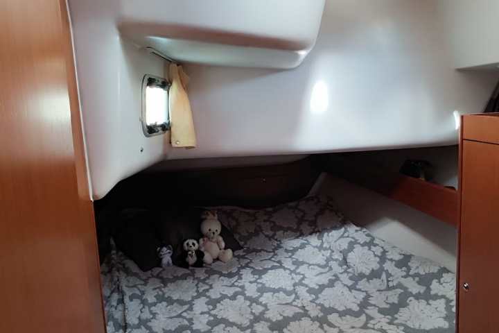 a room with a bed and a mirror