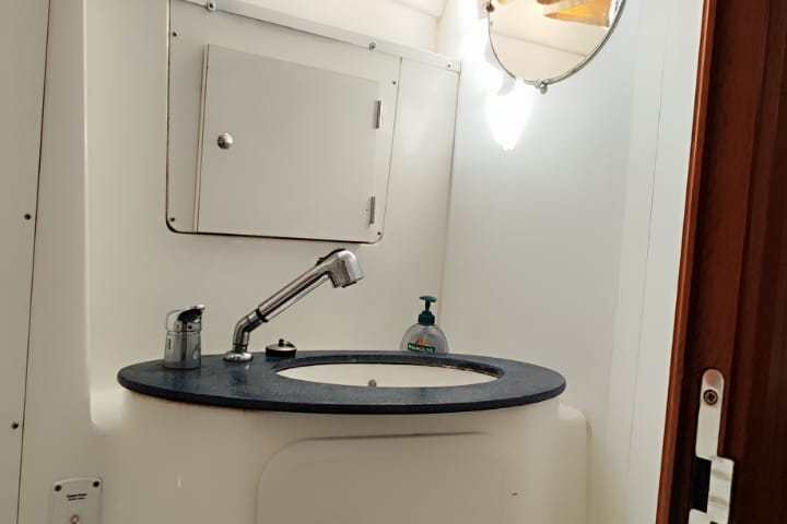 a close up of a sink and a mirror