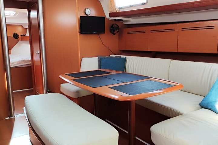 a bedroom with a bed and desk in a room