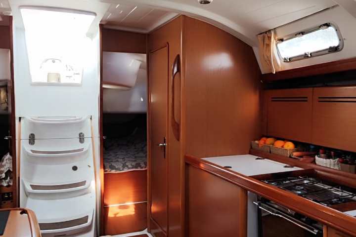 a stove top oven sitting inside of a kitchen