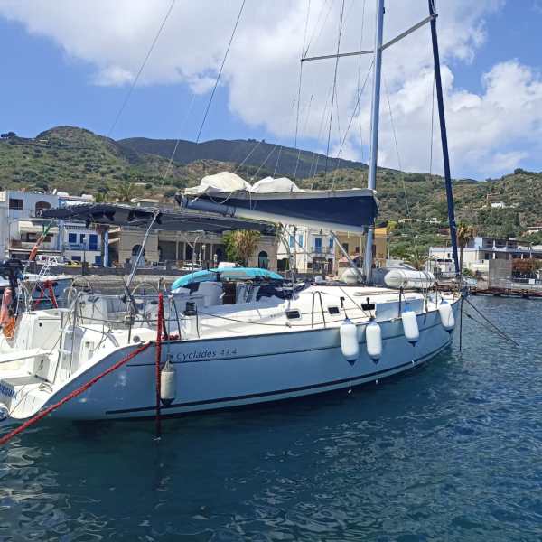 a boat is docked next to a body of water