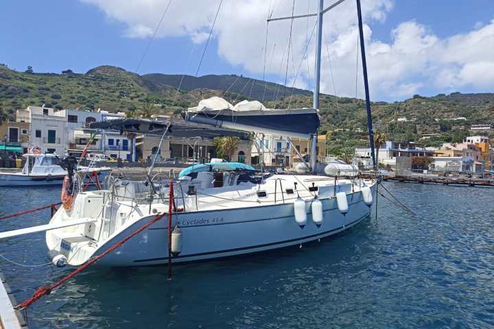 a boat is docked next to a body of water