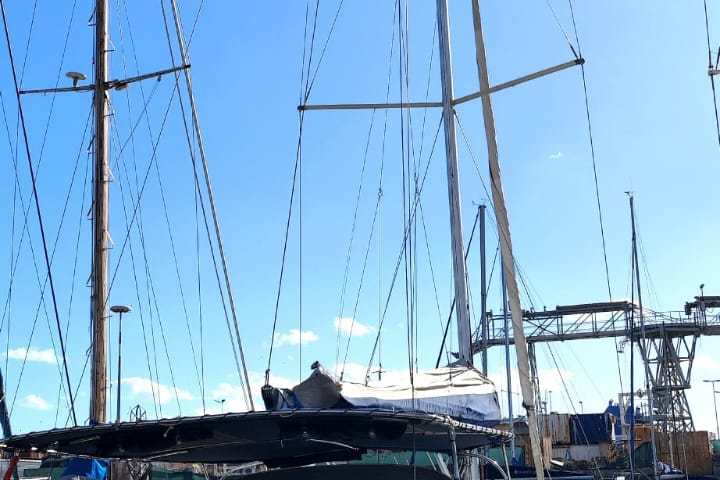 a boat is docked next to a body of water