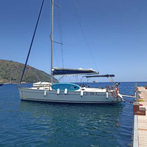 a boat is docked next to a body of water