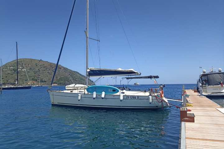 a boat is docked next to a body of water