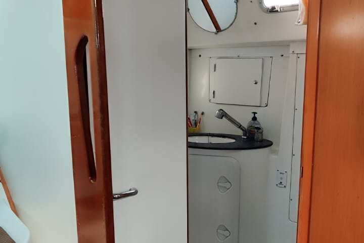 a bedroom with a bed and a mirror