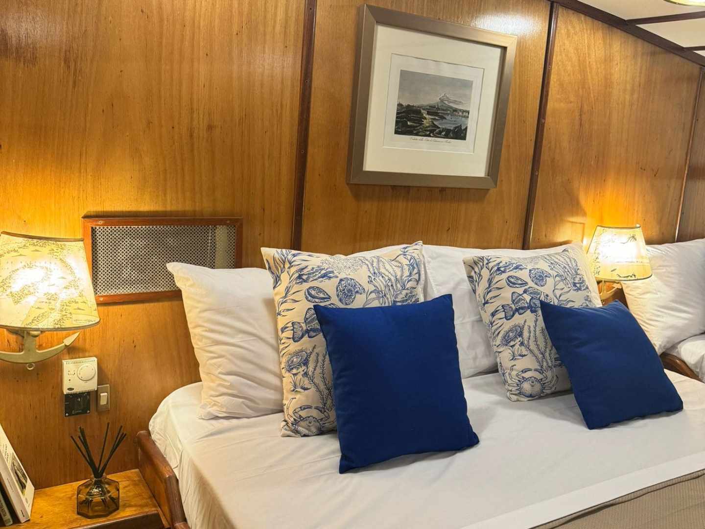 a bedroom with a bed and a chair in a room