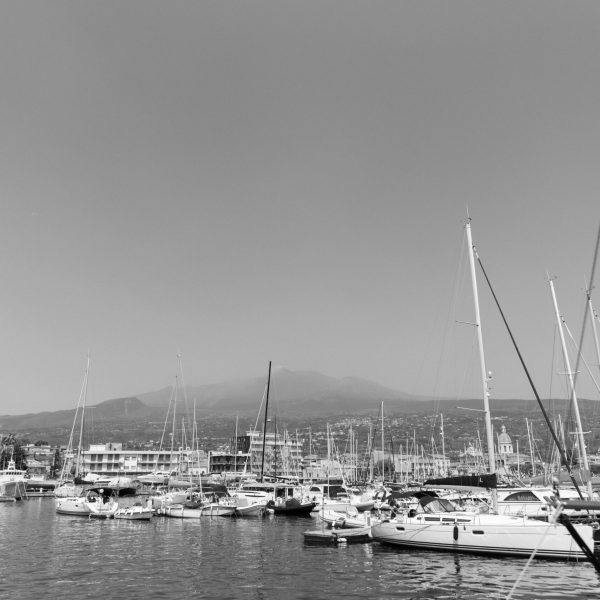 a boat is docked next to a body of water