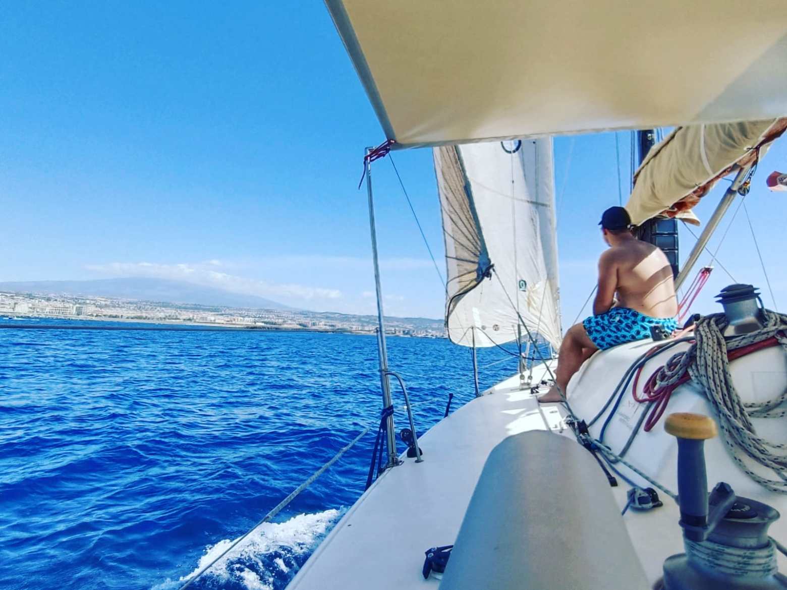 a man riding on the back of a boat