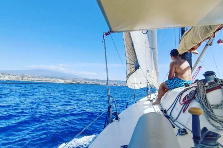 a man riding on the back of a boat