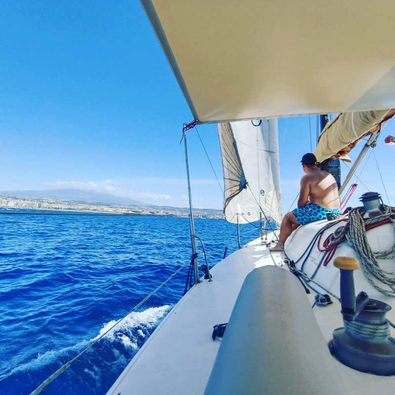 a man riding on the back of a boat
