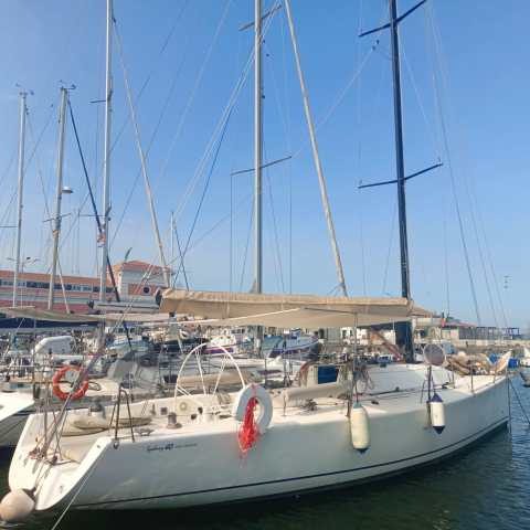 a boat is docked next to a body of water