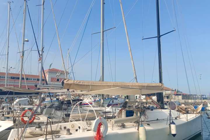 a boat is docked next to a body of water