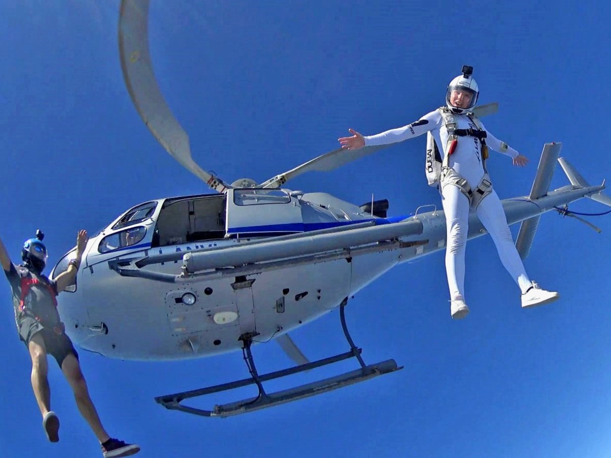 a person riding on the back of a boat