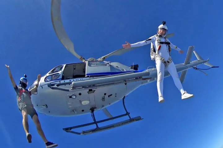 a person riding on the back of a boat