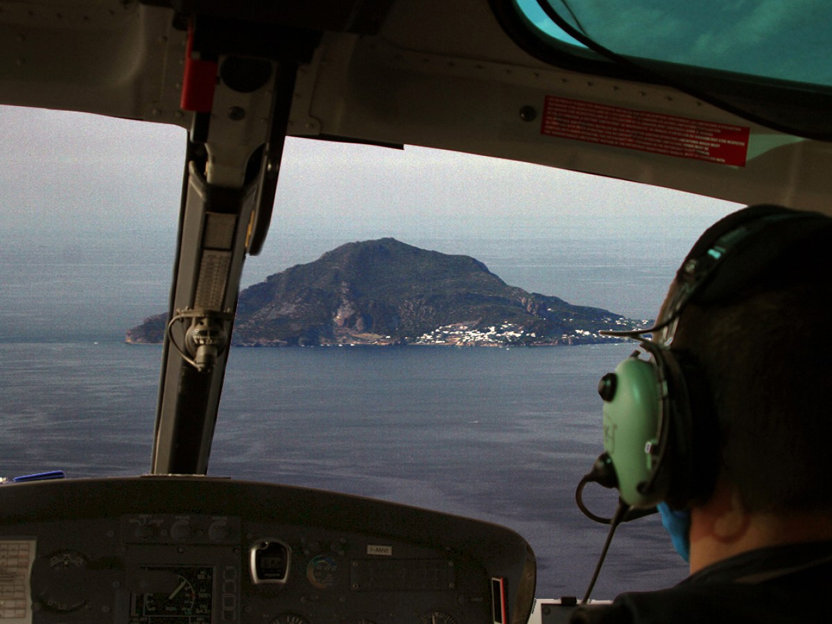 a person standing in front of a mirror posing for the camera