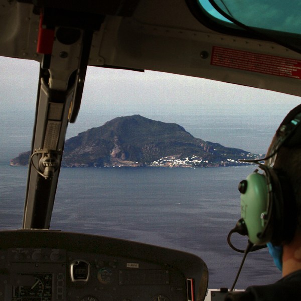 a person standing in front of a mirror posing for the camera