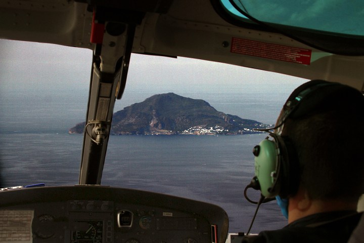 a person standing in front of a mirror posing for the camera