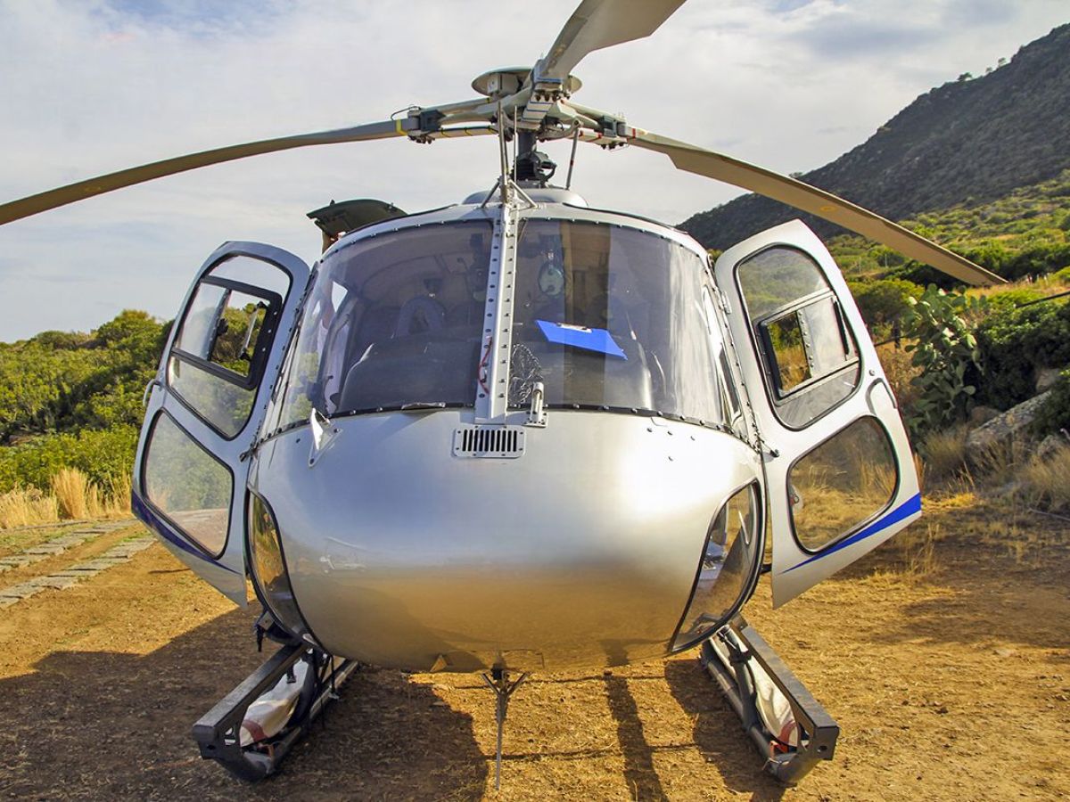 a helicopter parked on the side of a mountain