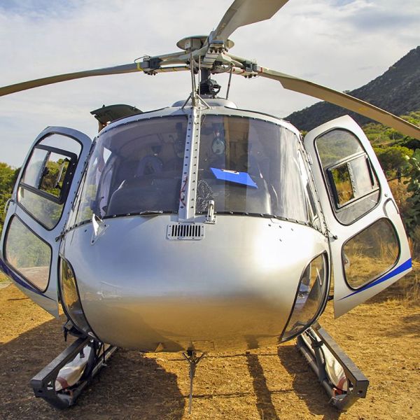 a helicopter parked on the side of a mountain