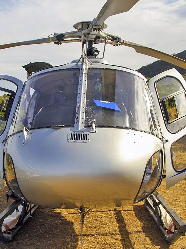 a helicopter parked on the side of a mountain