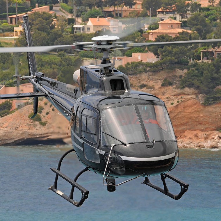 a helicopter flying over a body of water
