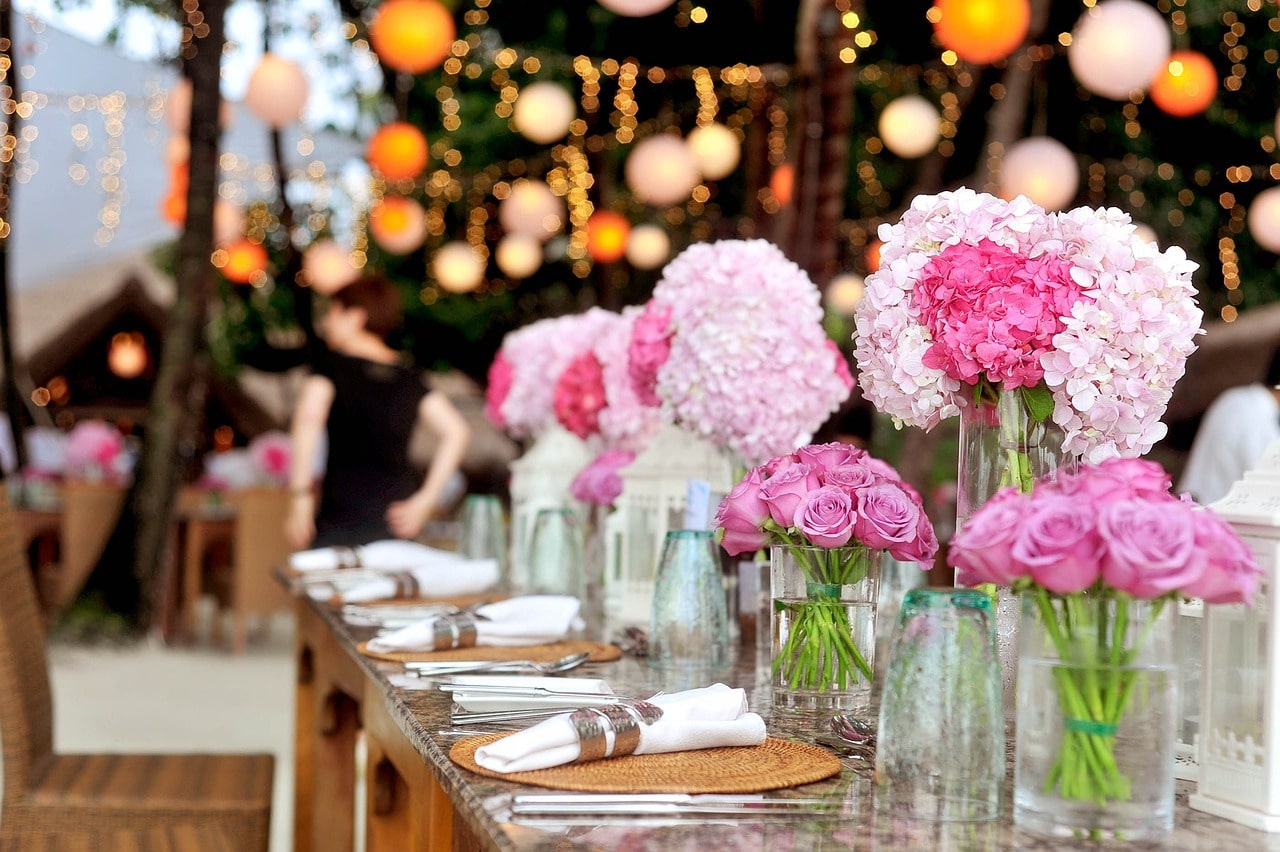 a group of pink flowers on a table