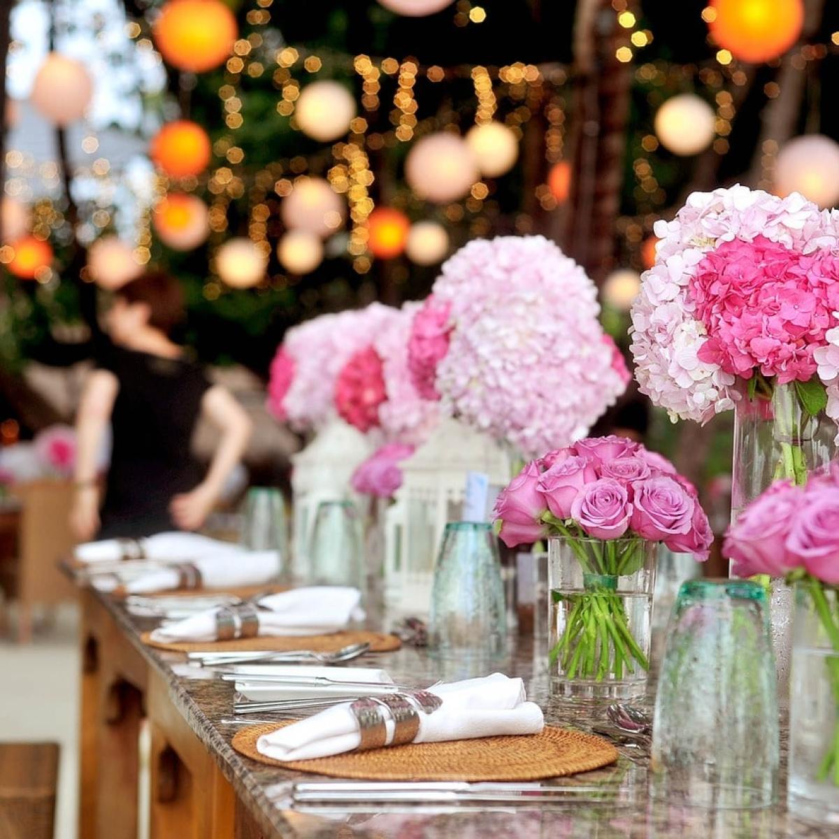 a group of pink flowers on a table