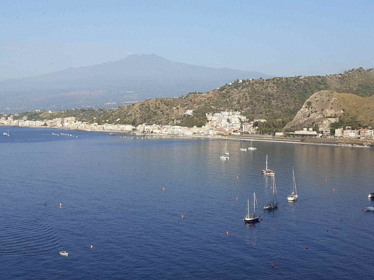 a small boat in a large body of water