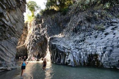 a large waterfall over a body of water