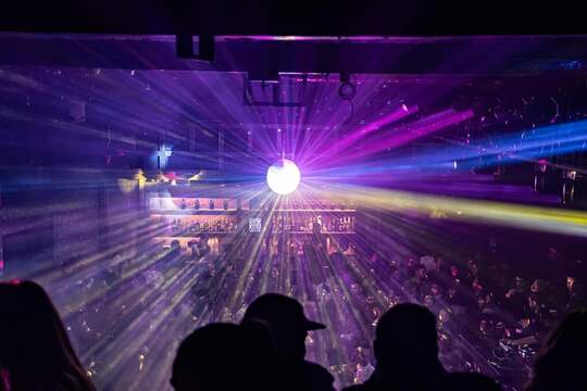 a group of people on a stage in front of a crowd