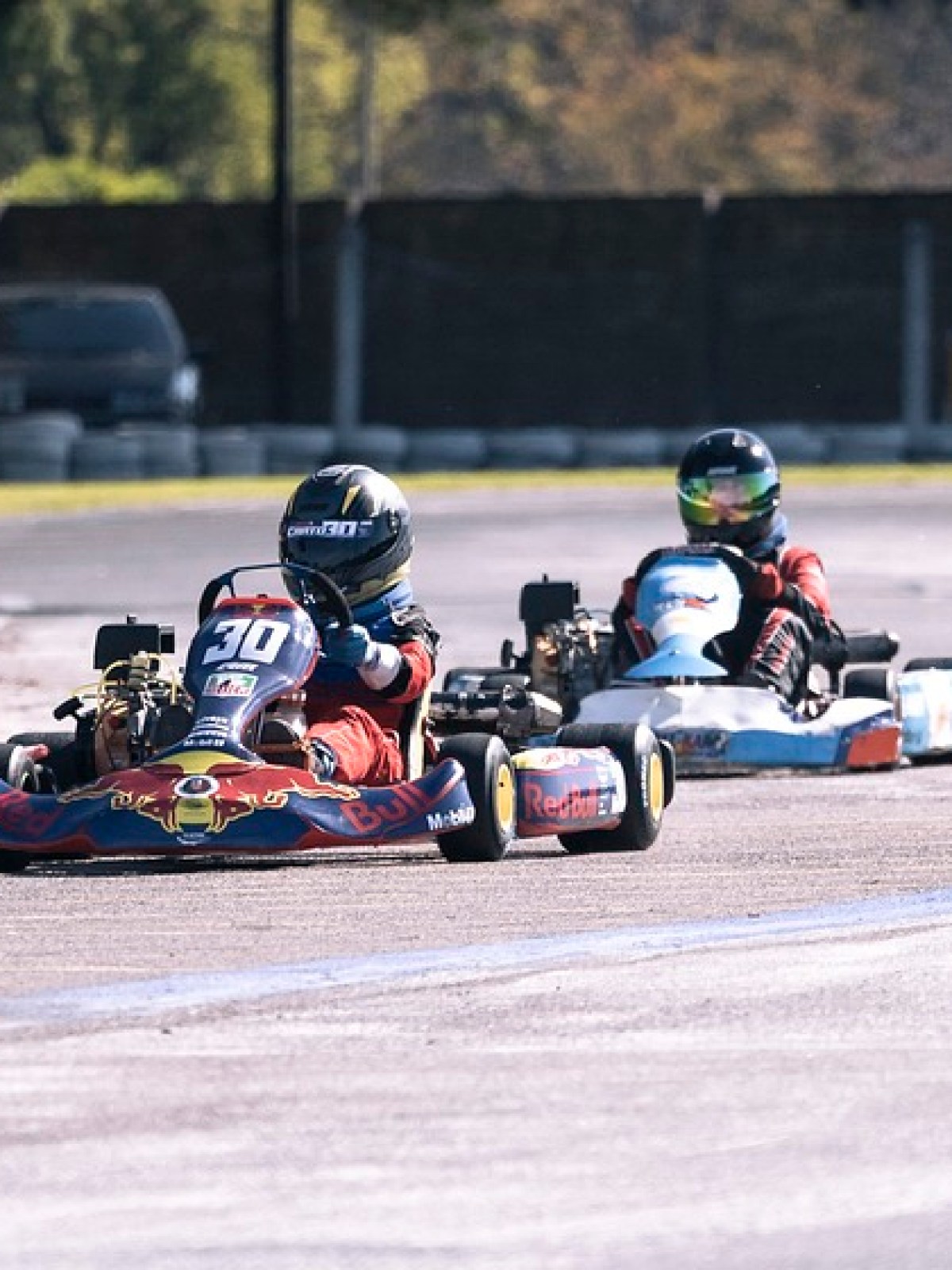 a person riding a motorcycle down the road