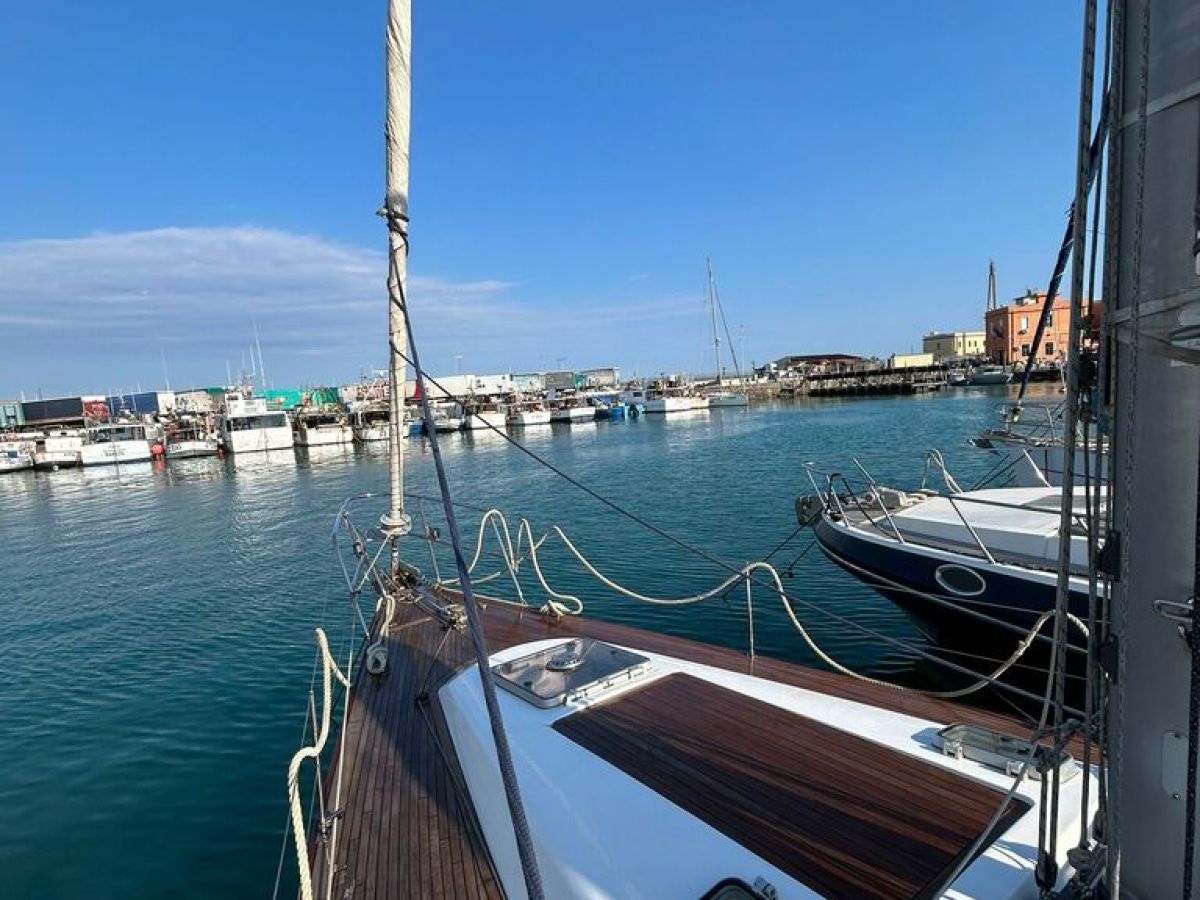 a boat is docked next to a body of water