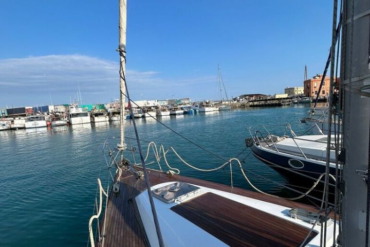 a boat is docked next to a body of water