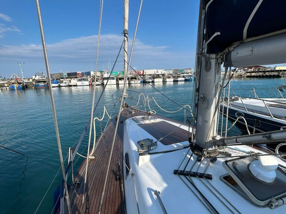 a boat is docked next to a body of water