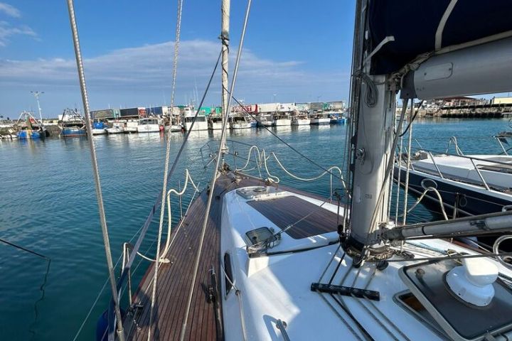 a boat is docked next to a body of water