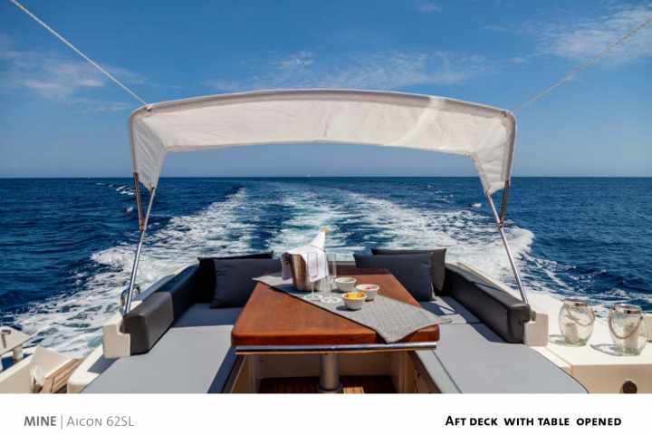 a close up of a boat next to a body of water