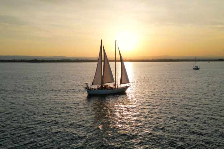 a small boat in a large body of water