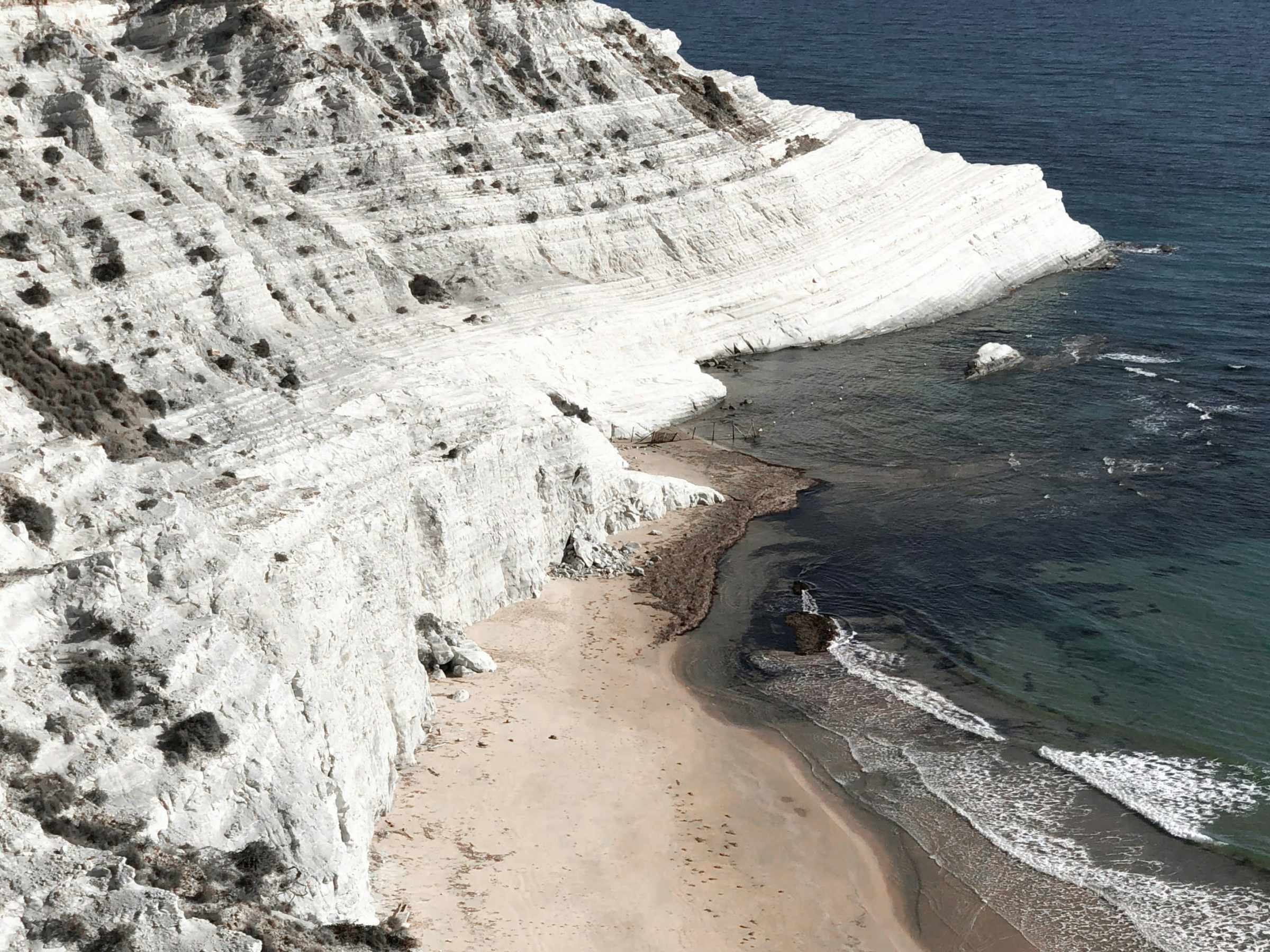a body of water with a mountain in the background